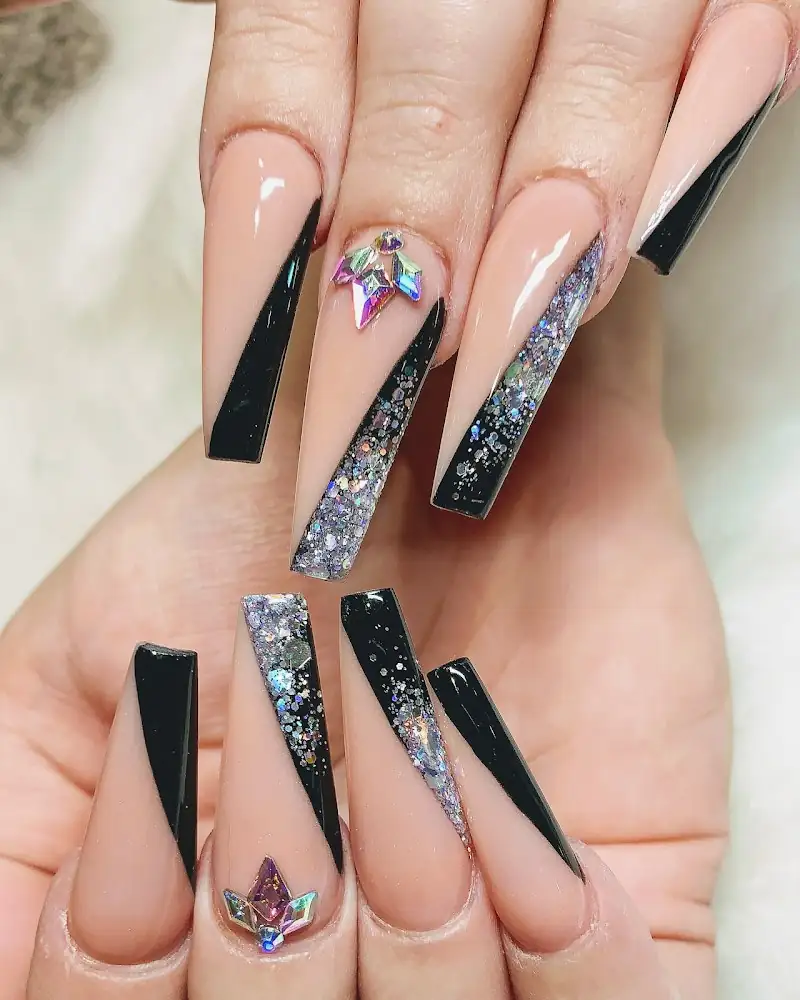 Long nude and black nails with glitter