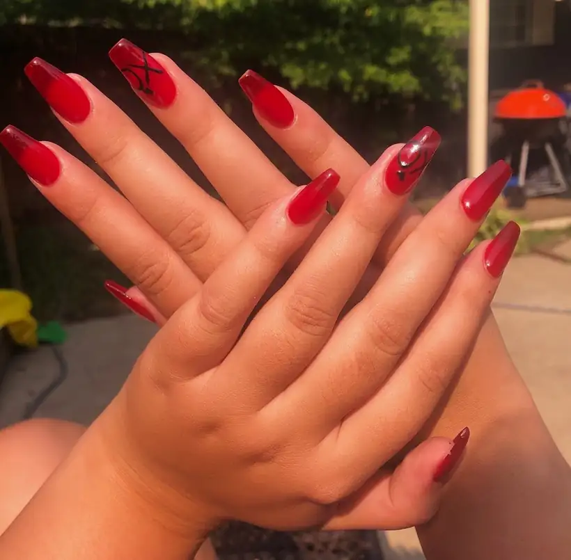Glossy red almond nails